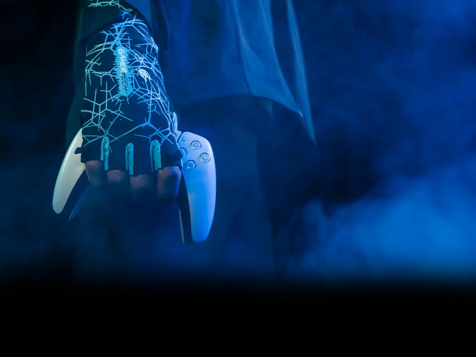 Esports player wearing the sub zero glove holding a gaming controller